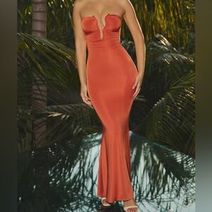 KEHLANI
Slinky Jersey Hardware Detail Strapless Maxi Dress in Burnt Orange